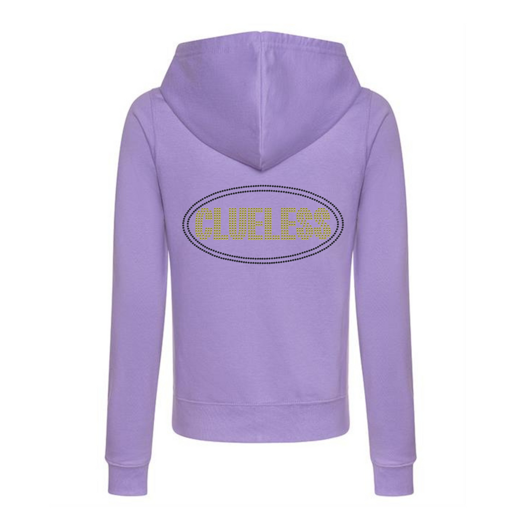 Purple zip up hoodie, bright yellow clueless writing in a block font, around the lettering is a black oval outline. The design is made up of sparkling rhinestones.
Design is placed on the back of the hoodie.