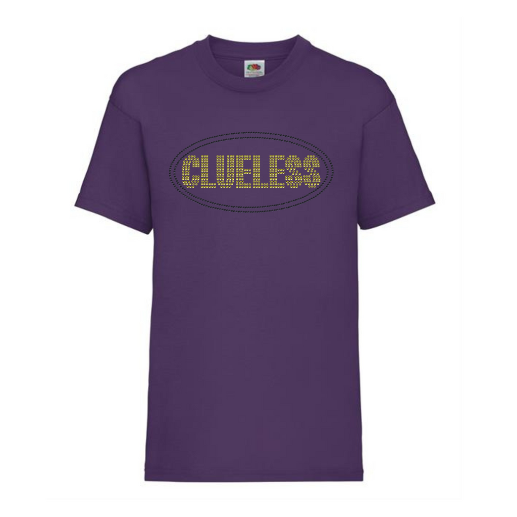 Purple cotton t shirt with bright yellow clueless writing in a block font, around the lettering is a black oval outline. The design is made up of sparkling rhinestones.
Design is placed on the front of the shirt.