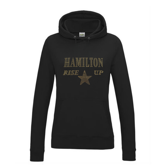 Black pullover hoodie with HAMILTON, RISE UP spelt out and a gold star underneath. The design is placed on the front in this image.
The hoodie has a front kangaroo pocket.
The design is made up of gold rhinestones that sparkle in the light beautifully.
