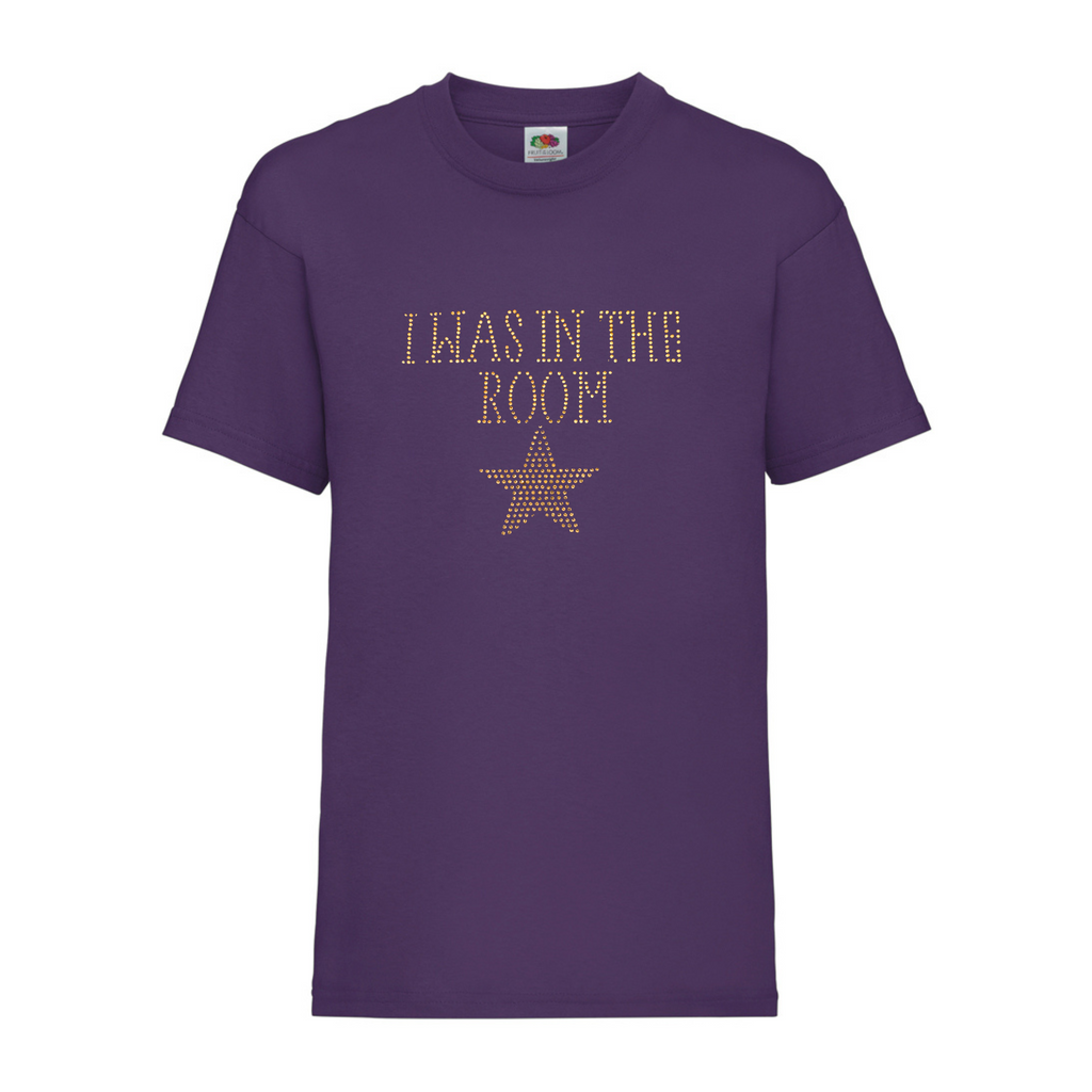 Purple cotton short sleeve t shirt with I WAS IN THE ROOM spelt out and a gold star underneath.
The design is made up of gold rhinestones that sparkle in the light beautifully.
