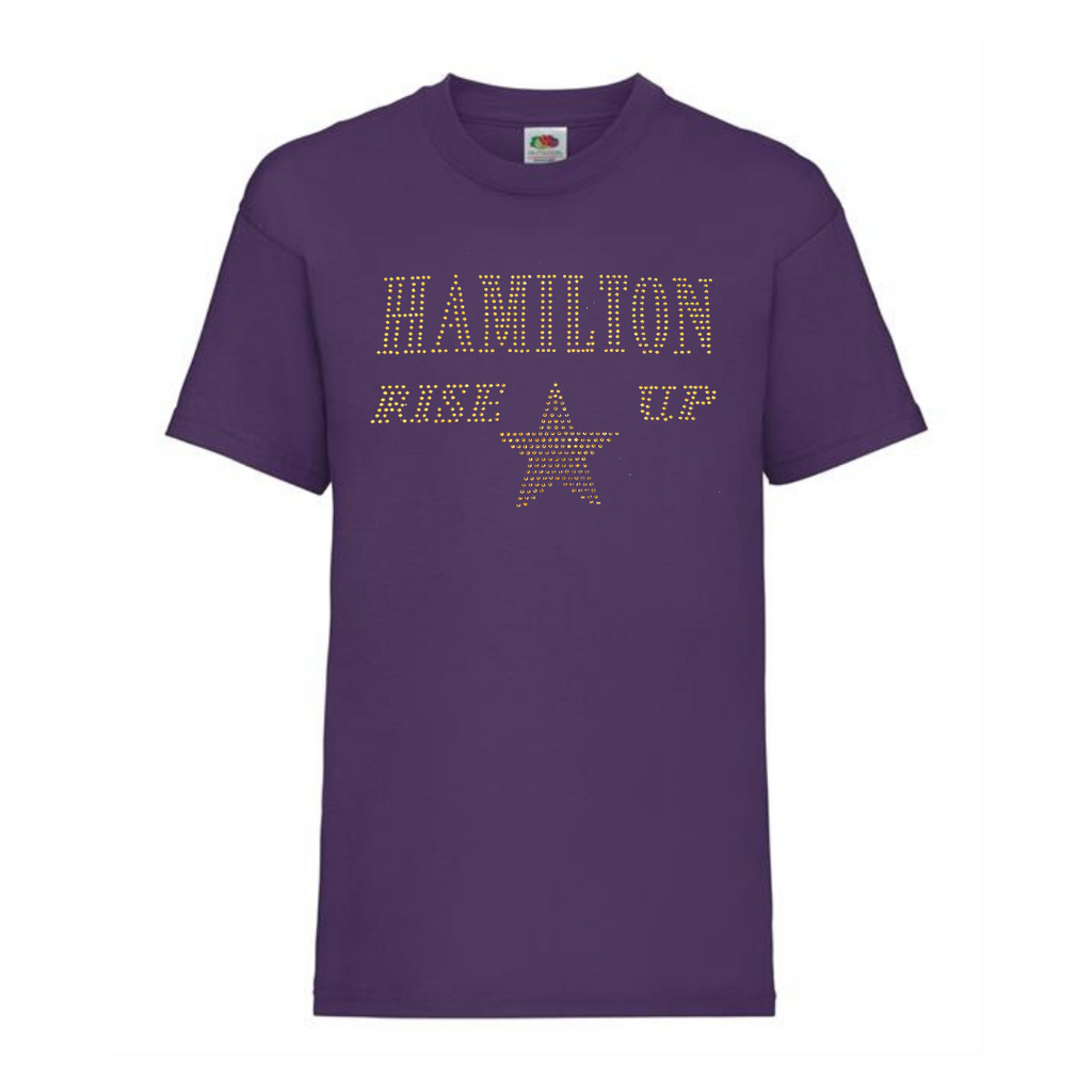 Purple cotton short sleeve t shirt with HAMILTON AND RISE UP spelt out and a gold star underneath.
The design is made up of gold rhinestones that sparkle in the light beautifully.
