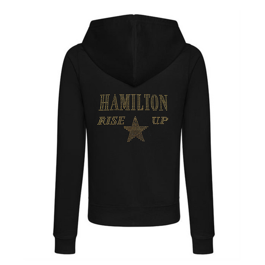Black zip up cotton hoodie with gold sparkling "Hamilton Rise up" with a gold star set just underneath.
design is made up of sparkling rhinestones that catch the light beautifully