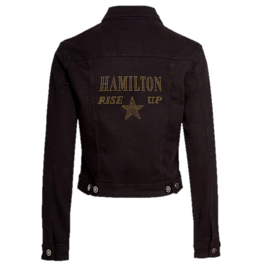 Soft denim jacket with gold sparkling "Hamilton Rose up" with a gold star set just underneath.
design is made up of sparkling rhinestones that catch the light beautifully