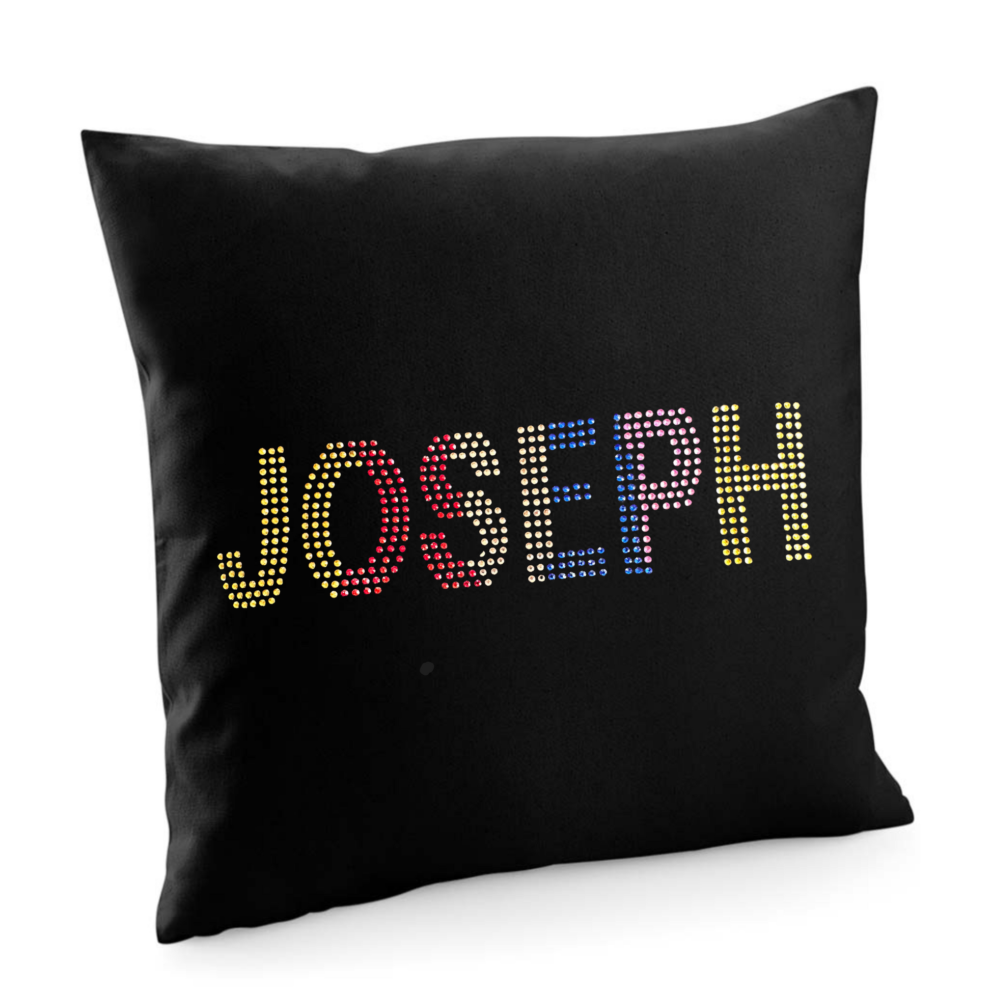 BLACK COTTON CUSHION COVER WITH JOSEPH LETTERING, THE LETTERING IS GOLD GRADUATING INTO RED, THEN CHAMPAGNE, BLUE, PURPLE AND BACK TO GOLD.
THE DESIGN IS MADE UP OF HOT FIX RHINESTONES THAT HEAT PRESSED AND CATCH THE LIGHT BEAUTIFULLY