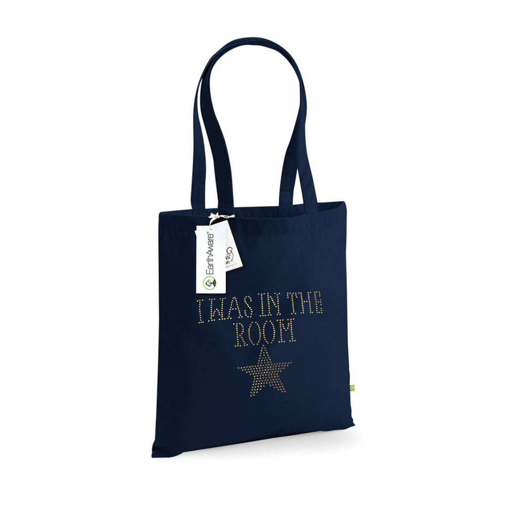 Navy cotton tote bag, on the front is a gold sparkling "I was in the room" lettering with a gold star set just underneath.
design is made up of sparkling rhinestones that catch the light beautifully