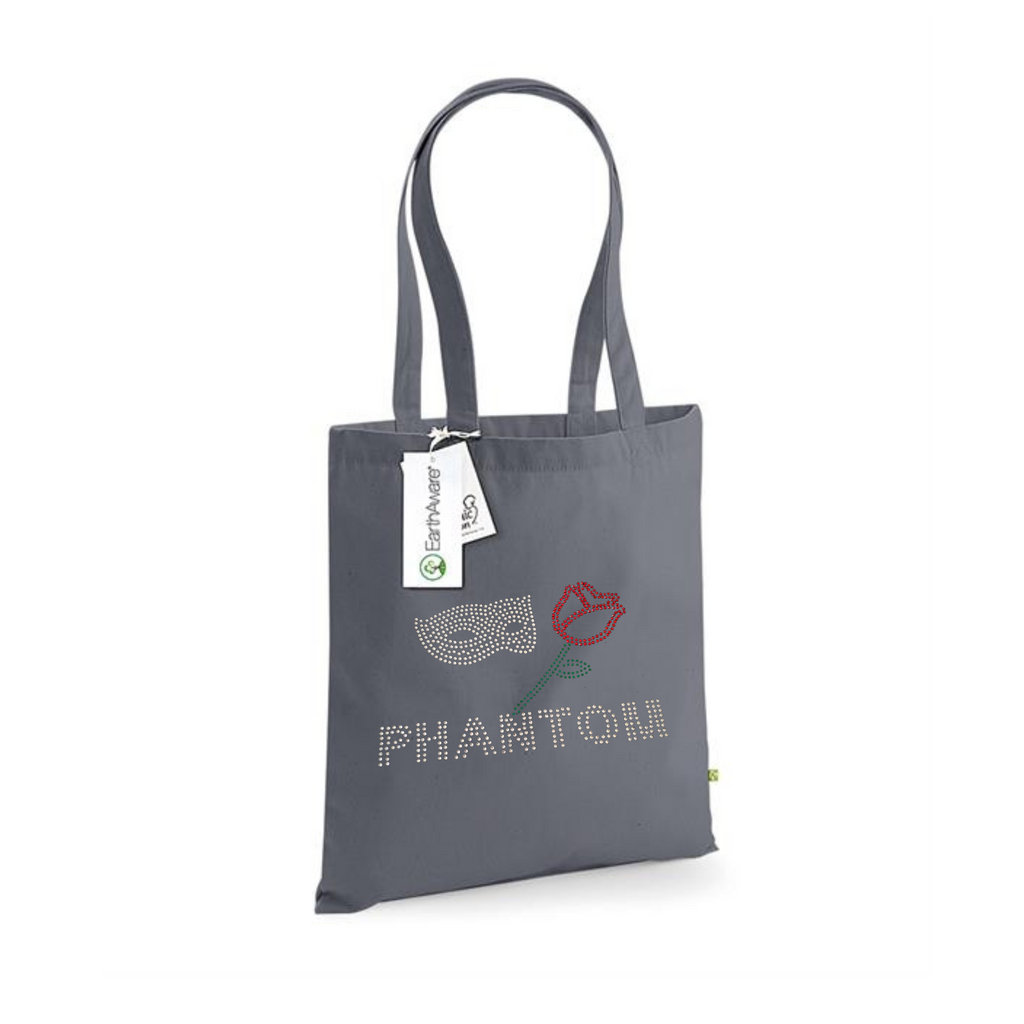 DARK GREY COTTON TOTE BAG WITH LONG HANDLES WITH PHANTOM LETTERING, ABOVE THIS A SILVER MASK AND RED ROSE WITH GREEN STEM AND LEAF.
THE DESIGN IS MADE UP OF HOT FIX RHINESTONES THAT HEAT PRESSED AND CATCH THE LIGHT BEAUTIFULLY
