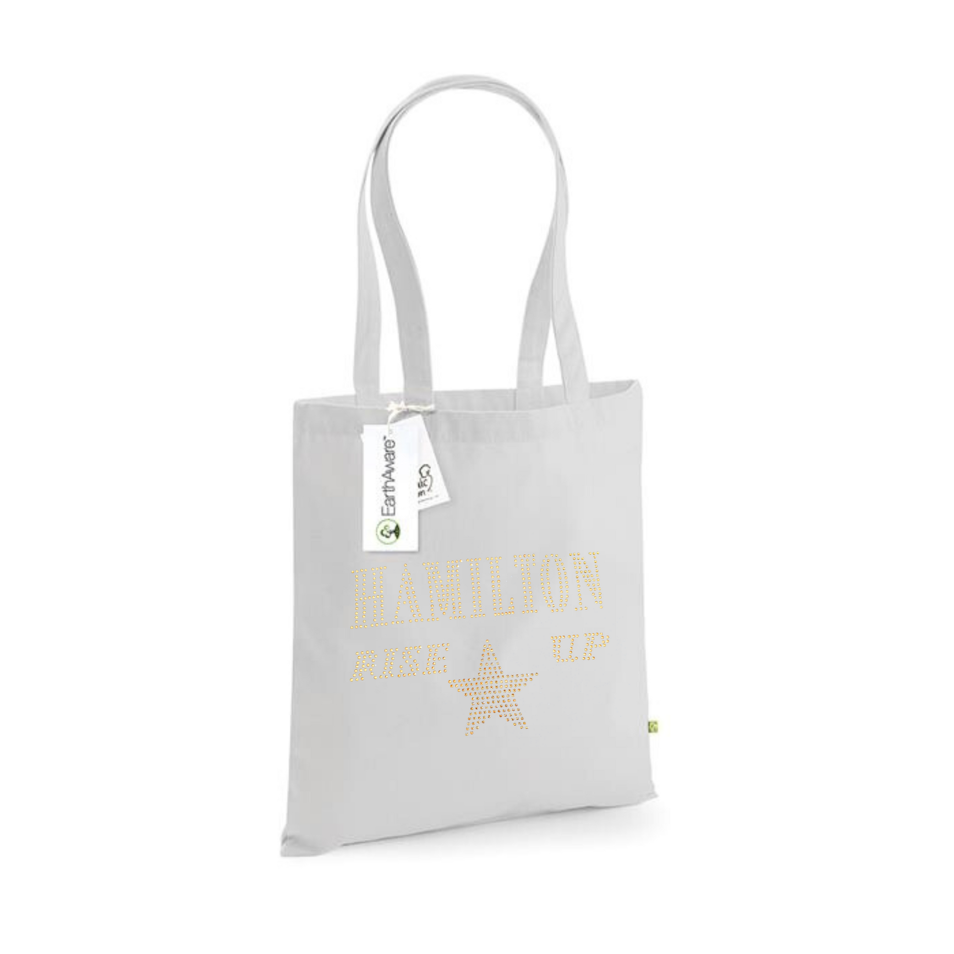 Light grey cotton tote bag, on the front is a gold sparkling "Hamilton Rose up" lettering with a gold star set just underneath.
design is made up of sparkling rhinestones that catch the light beautifully