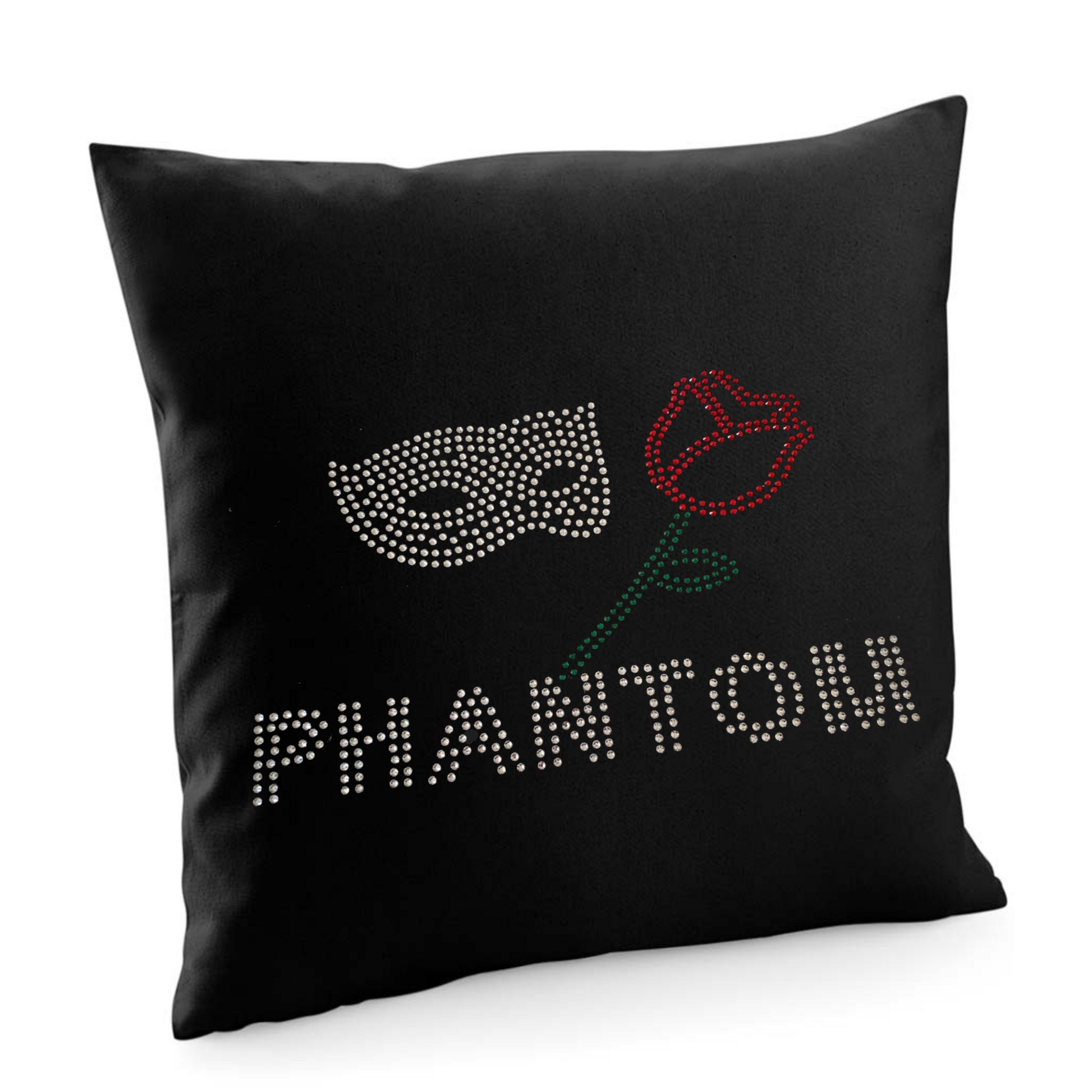 BLACK COTTON CUSHION COVER WITH PHANTOM LETTERING, ABOVE THIS A SILVER MASK AND RED ROSE WITH GREEN STEM AND LEAF.
THE DESIGN IS MADE UP OF HOT FIX RHINESTONES THAT HEAT PRESSED AND CATCH THE LIGHT BEAUTIFULLY